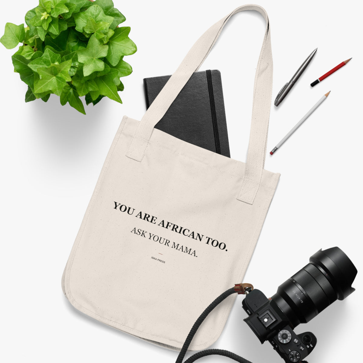 Natural canvas tote bag handle detail — Iska Press, WE ARE Drop 01